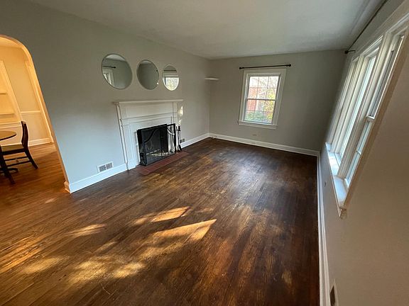 living room with wood burning fireplace. 18x10'9"