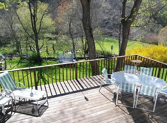 Large deck overlooking expansive rear yard. Private.