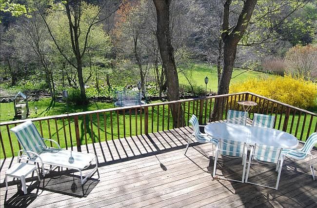 Large deck overlooking expansive rear yard. Private.