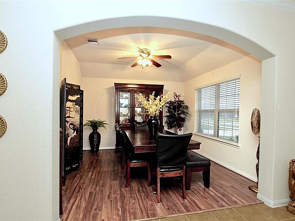 A gracious archway off the foyer defines the Dining Room.