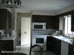 Kitchen towards front and side entrance