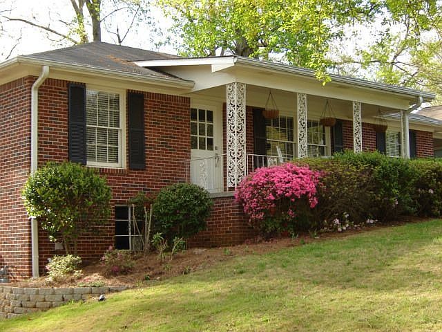 Side view of the home, extensive landscaping getting ready to bloom