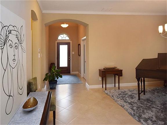 Looking toward the front door, the expanse of space opens.