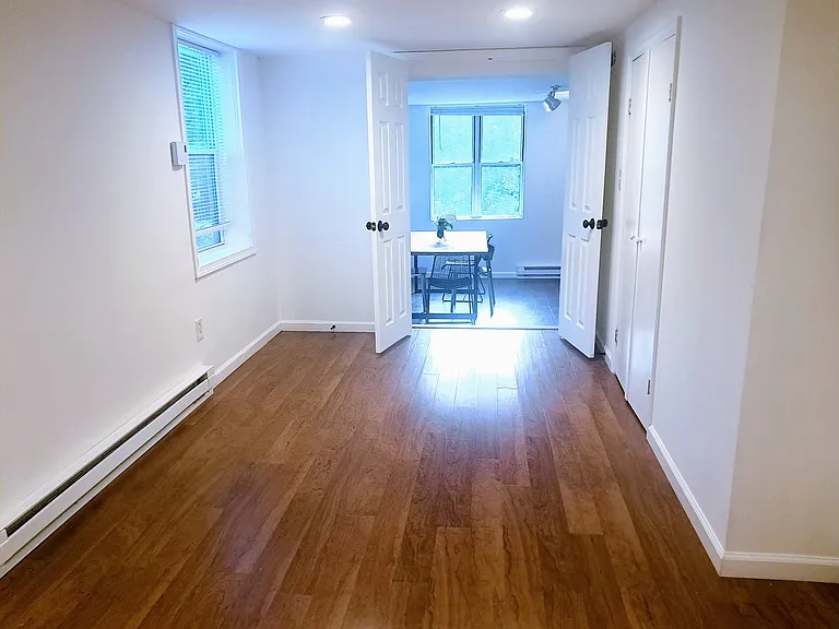 Large bedroom with recessed lighting.
