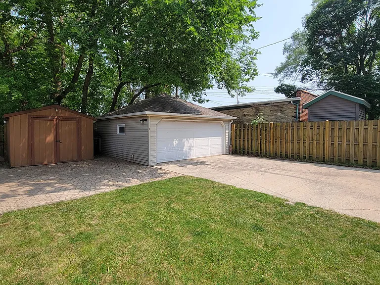 Plenty of off street parking with a private backyard, two car garage and shed.