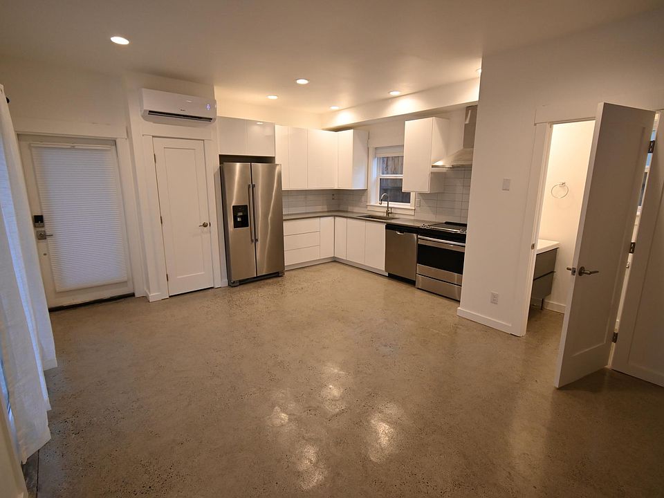 Main floor area of ADU. Kitchen, 1/2 bath, and living space