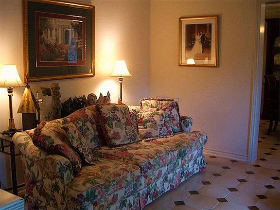 LIVING ROOM VIEW.  THERE IS A LONG WALL FOR PLACING FURNITURE .  IT HAS  TILE FLOORING.