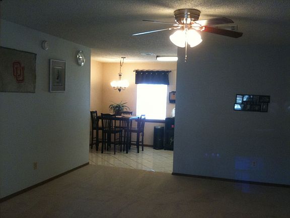 Living area looking to kitchen