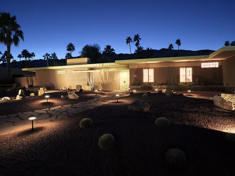 The house at night in the beautiful and historic Deepwell Estates neighborhood in south Palm Springs.