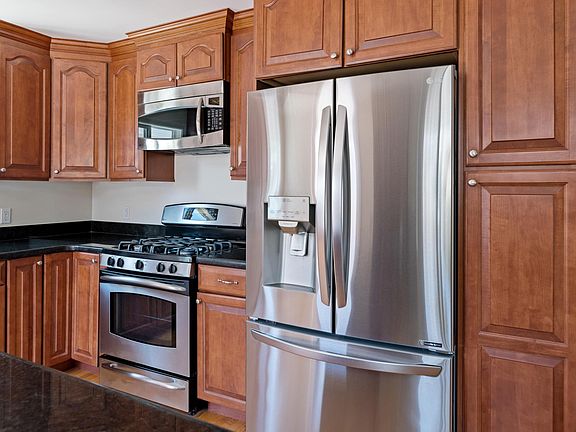 Another angle of the kitchen, showcasing the modern LG and GE appliances.