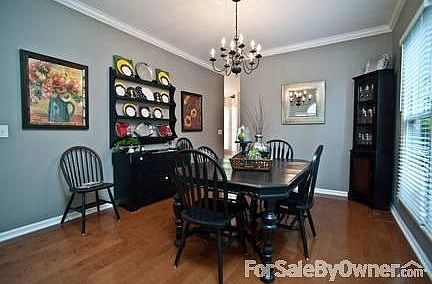 Dining Room
						:
						This lovely dining room with crown moulding is open to the foyer and living room