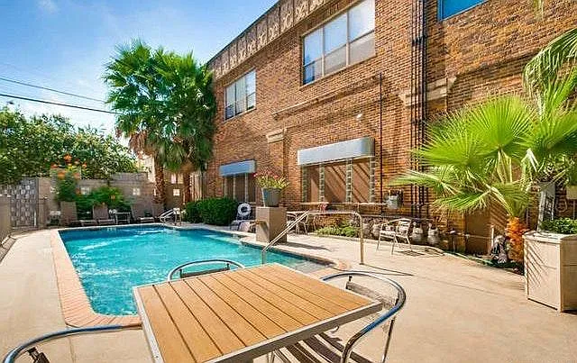Relaxing community patio area includes grill.