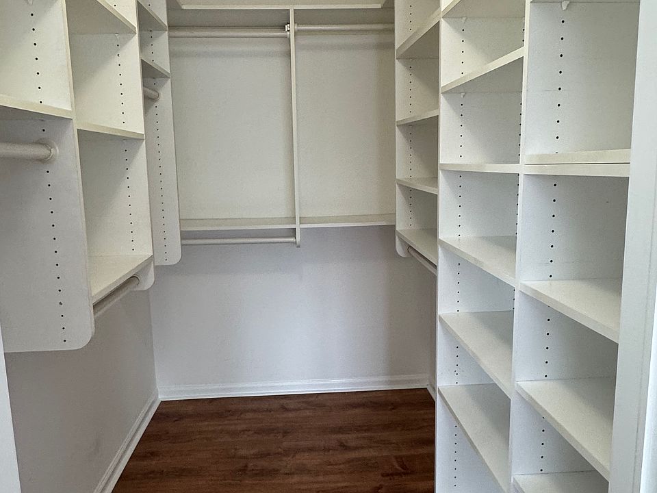 Custom closet in primary bedroom suite