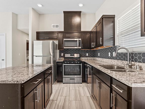 Kitchen with new stainless steel appliances