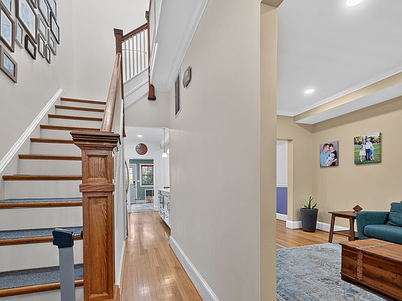 Upon entering the front door, stairs go up to the left, and the family room is on the right.