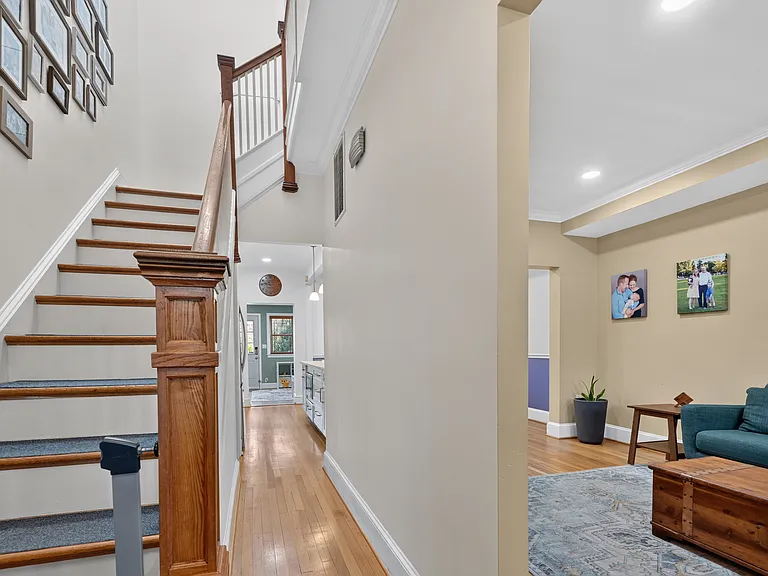 Upon entering the front door, stairs go up to the left, and the family room is on the right.