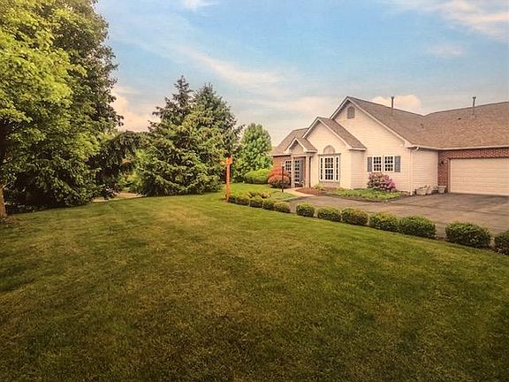 End Unit on Culdesac. Green Space across from unit. The unit is GREY with white garage door. Photo coloring is off. See next photo for colors.