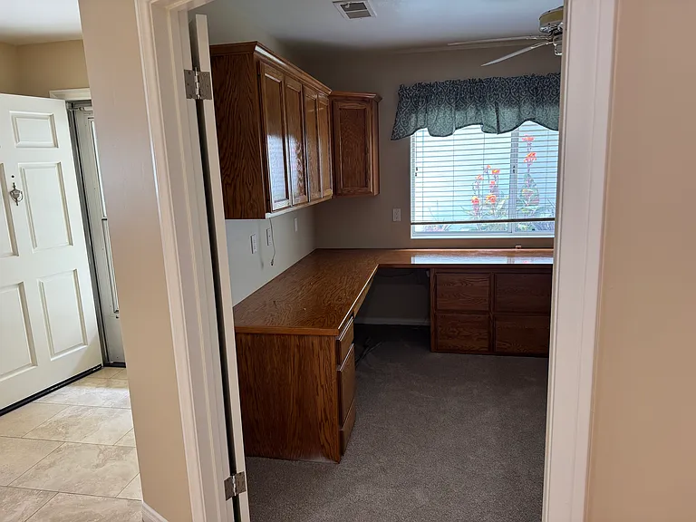 Downstairs Office with closet. Has built in wrap around desk with 2 work stations.
