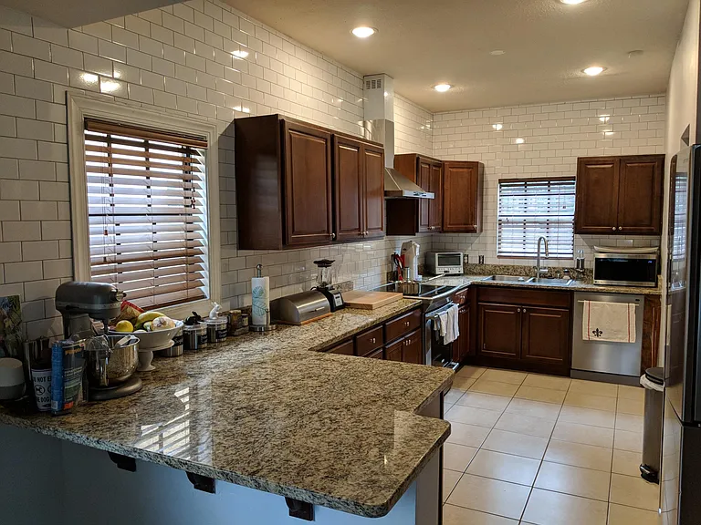 Kitchen with new subway tile backsplash/walls and stainless