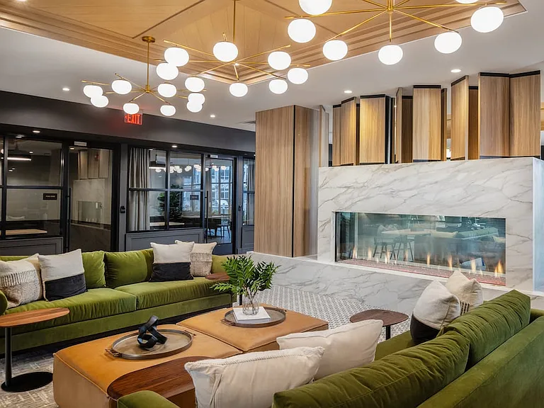 Lobby and leasing area with fireplace and lounge seating