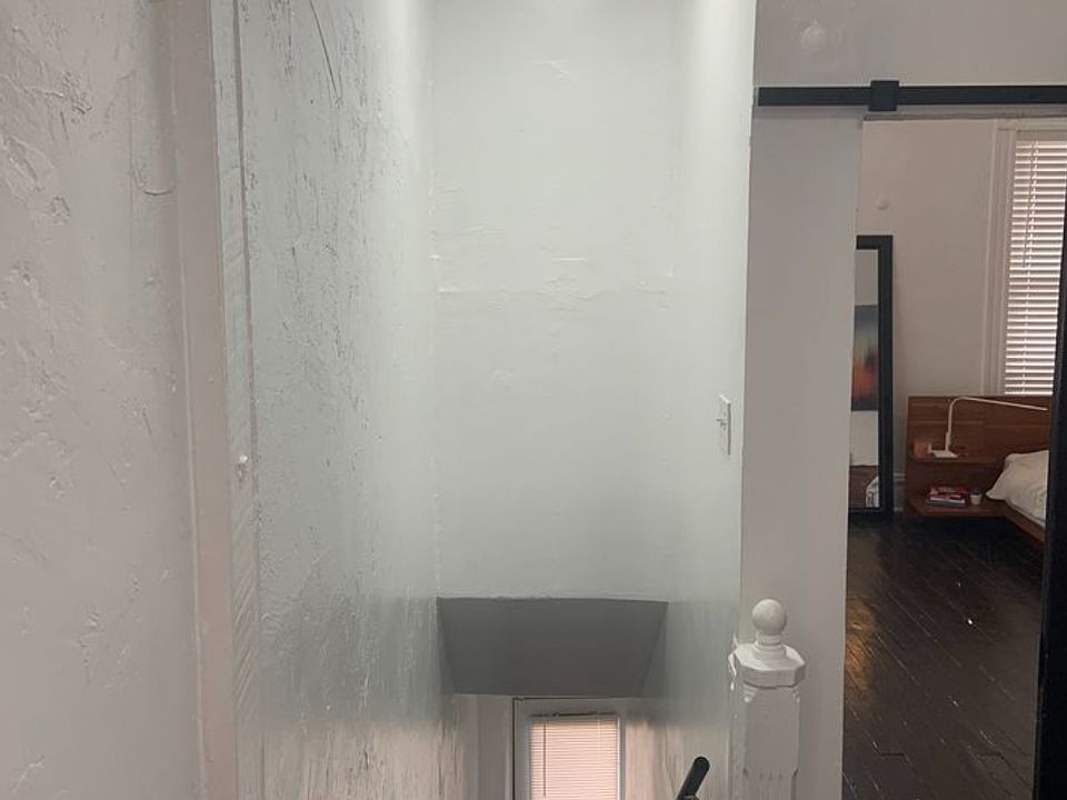 Entryway, showing access to bedroom