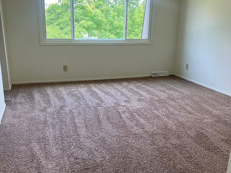 Primary bedroom w/private bath and shower.