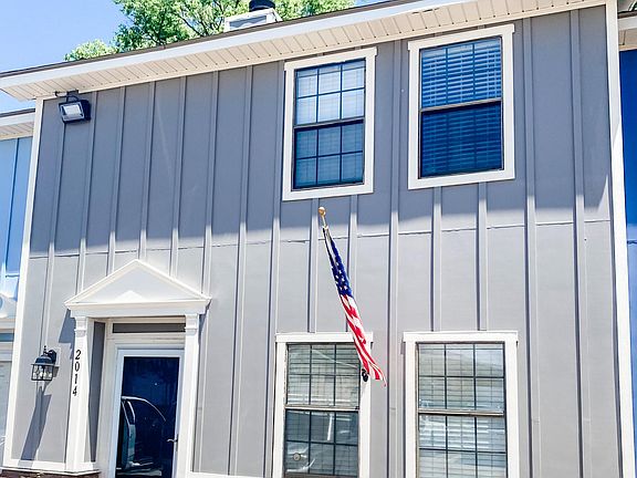 Exterior with new siding and stone