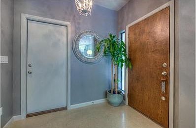 Door leading to 1 car attached garage, front door on the right.