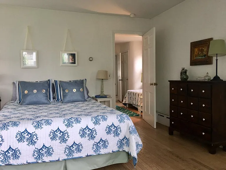 Guest or kids bedroom (part of jack & jill attached bedrooms) with queen bed, closet, loveseat and desk