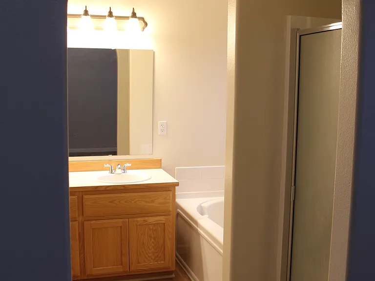 Master bedroom bathroom with shower and tub and separate toilet room