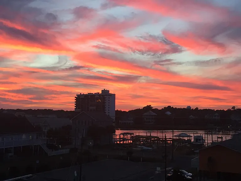 Master bedroom balcony view of harbor at sunset