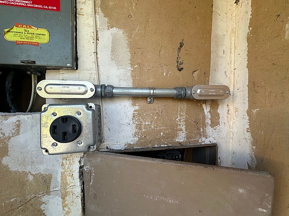 EV Charging plug inside of utility closet