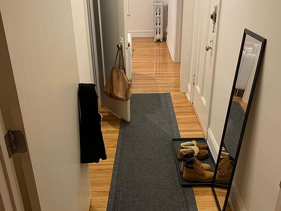 Hallway from bedroom to front door and living room