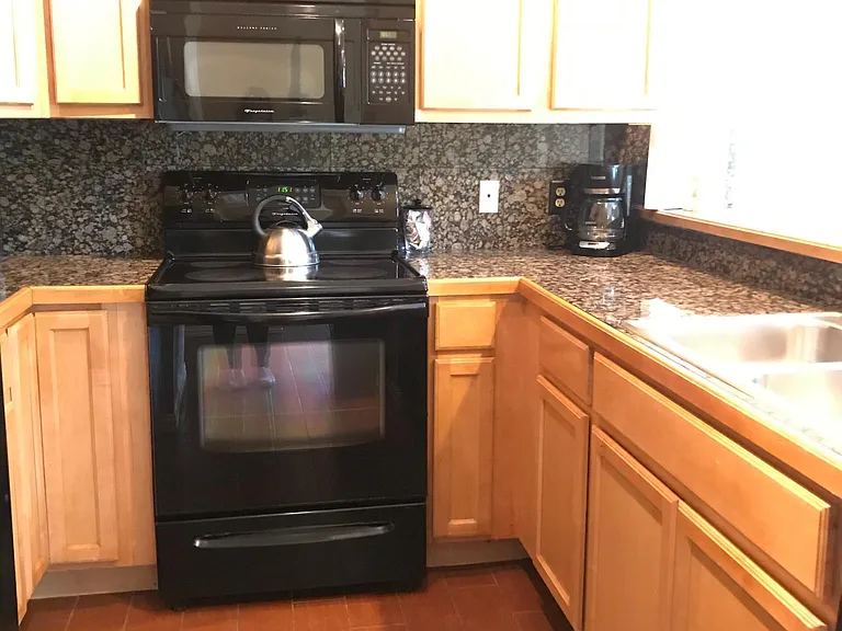 Kitchen w/ Fridge, Oven, Microwave, and Dishwasher