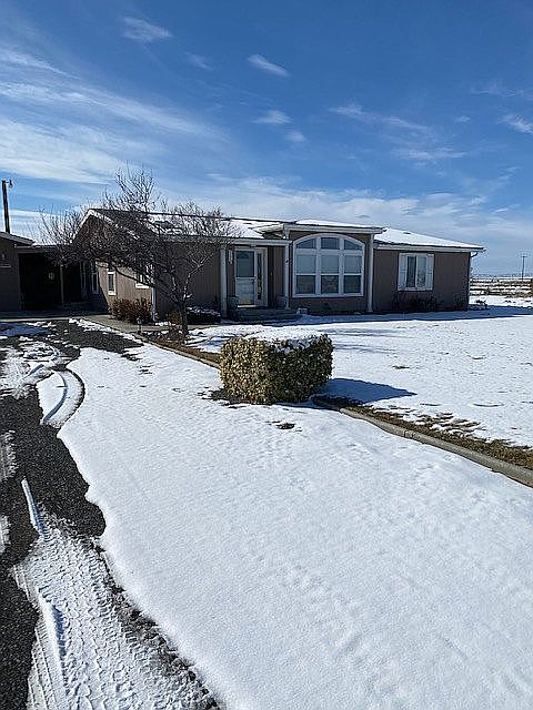 FRONT OF HOUSE FACES EAST