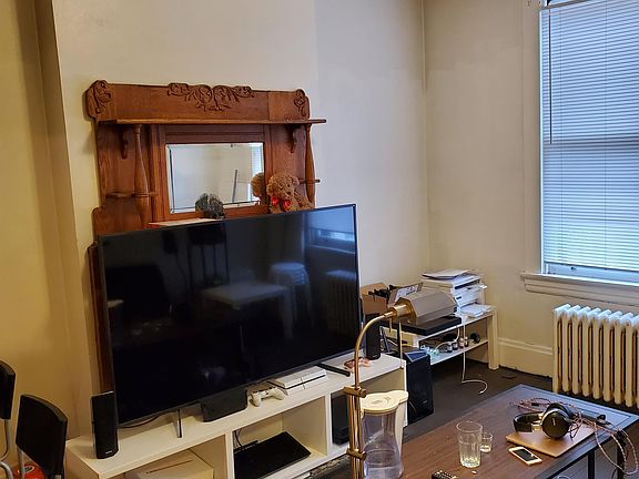 Living Room with wood floors and original mantle