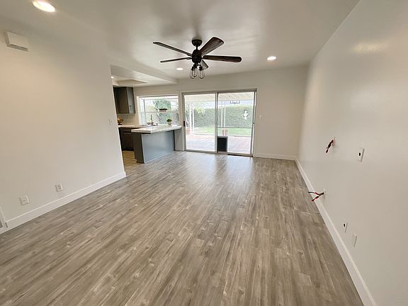 Separate Family Room open to the kitchen, overlooking the backyard.