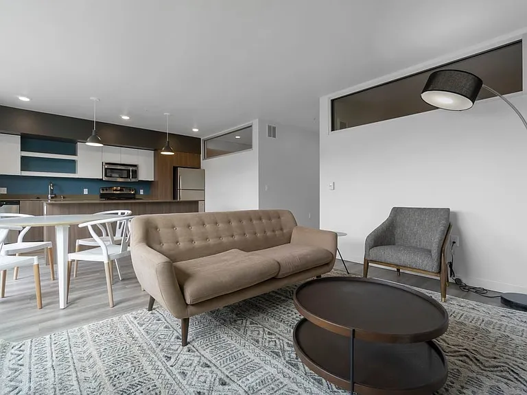 Furnished+ apartment homes come outfitted with a sofa, side chair, side table, coffee table, dining set, TV stand and 50" Television (Representative Image exact items and style of furnishings may vary)