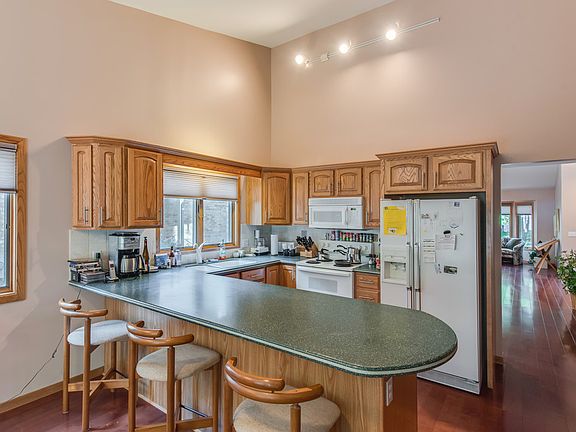 Open kitchen with breakfast bar.