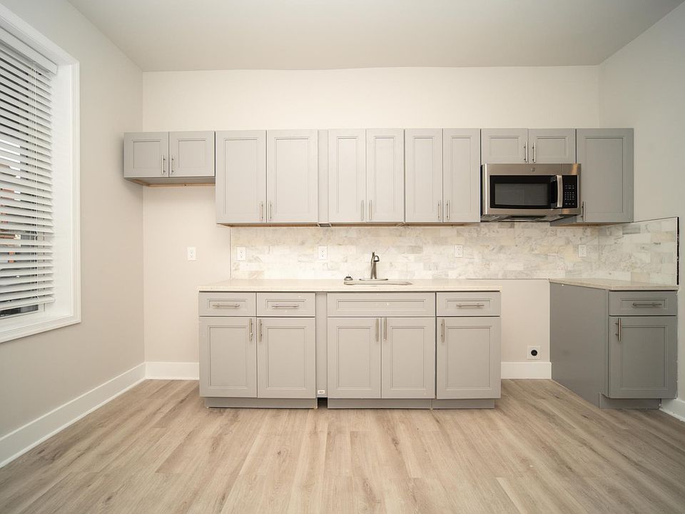 Kitchen includes a stove and fridge