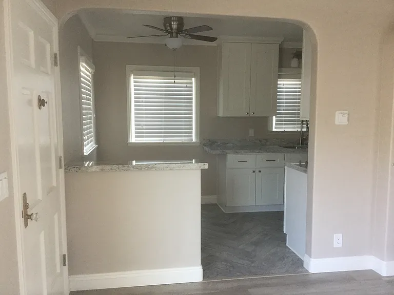 View from the living room; front door is on the left which leads into the dining area