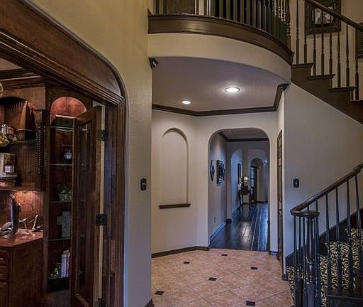 As you walk in the front door, you are greeted by an impressive foyer, with amazing finishes throughout this beautiful home.