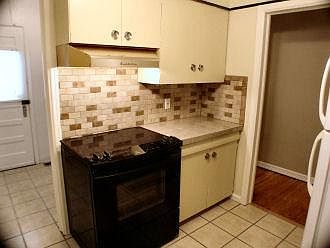 Kitchen showing door to utility room