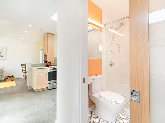 Bath and hall leading to kitchen/living area