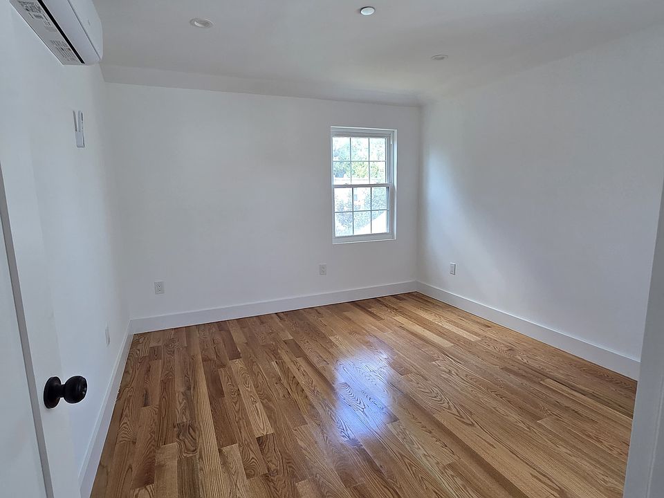 Third Bedroom
This additional bedroom offers hardwood floors, a large window for natural light, and a comfortable layout that works well as a bedroom, guest room, or home office.