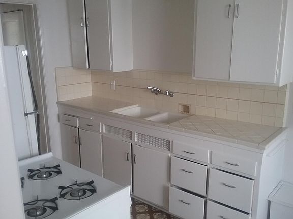 tile counter top kitchen with eating area