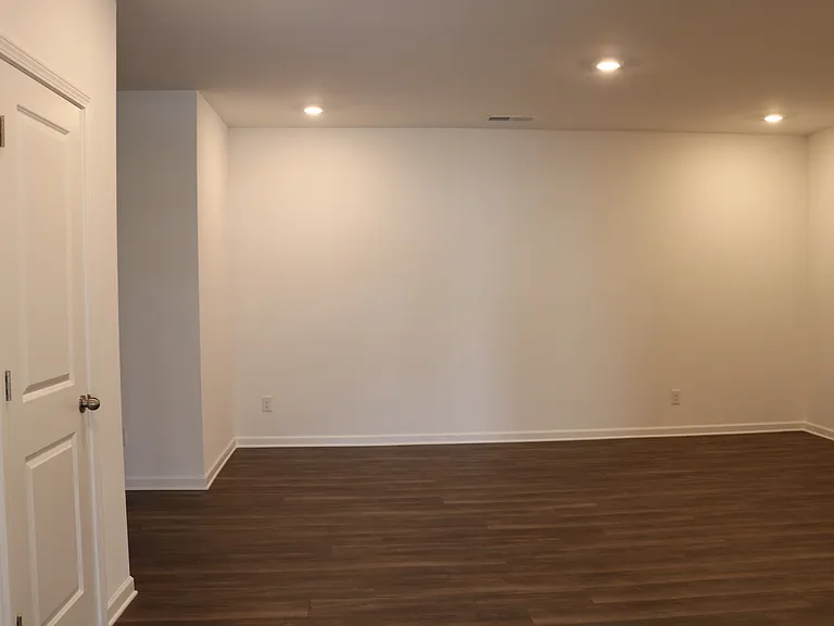 Large recreation room in basement, next to garage