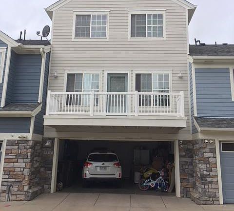 Back of townhome w/2 car garage and balcony
