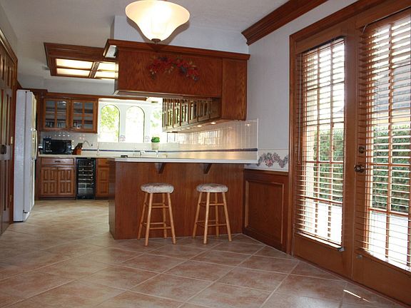 French doors in breakfast room.  Love that porcelain tiled floor.