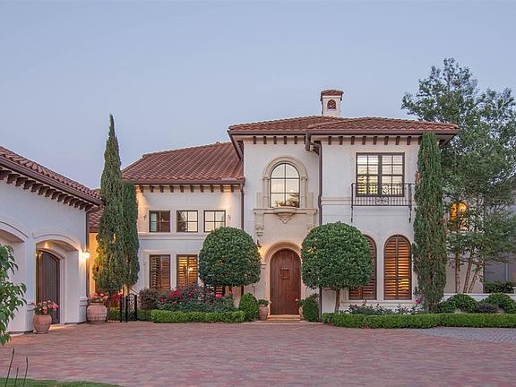 Tile roof, stucco exterior, asymmetrical roofline, curves, arches, balconies, iron work gates, wooden doors, courtyards, patios with arcades...all create the distinctive Spanish Revival detail with classic character and charm.